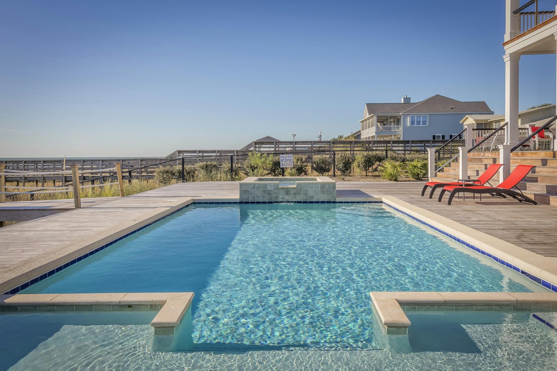 Stunning infinity pool at a seaside resort, perfect for relaxation and leisure travel.